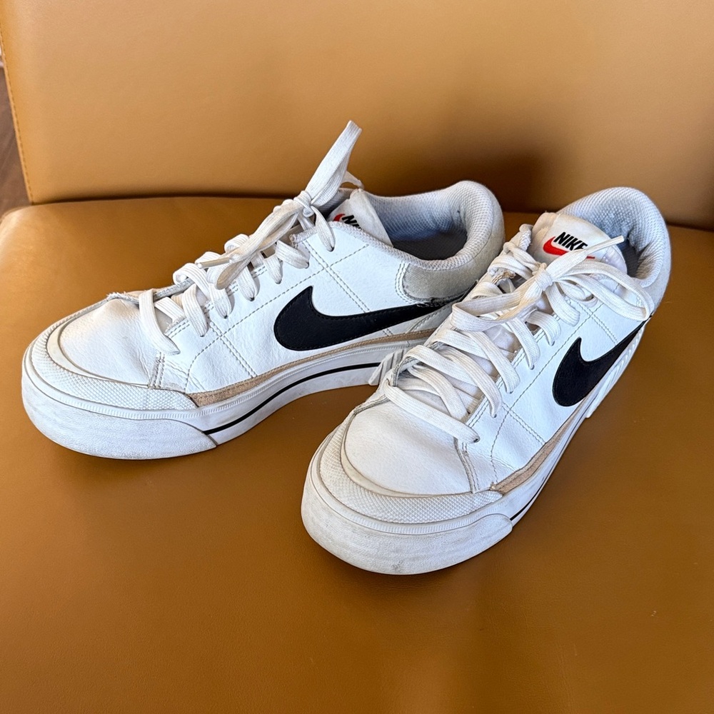 Nike White Low-Top Sneakers with Black Swoosh and Beige Trim